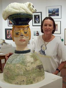 Ceramic sculpture of Bo Peep an English girl with lamb on her head and landscape drawing on body